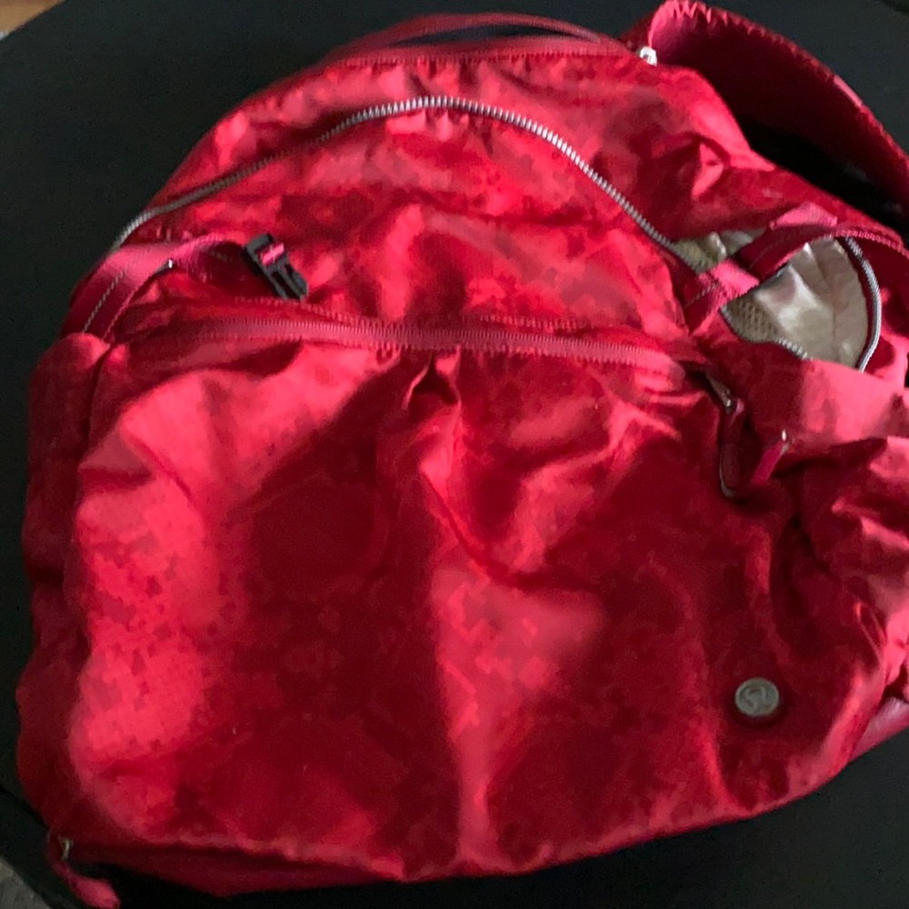 Red snake print back pack